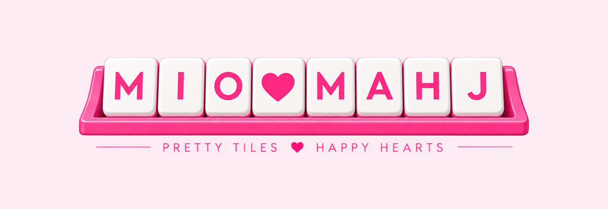MIO Mahj mahjong rack with tiles spelling MIO heart MAHJ and tagline Pretty Tiles Happy Hearts